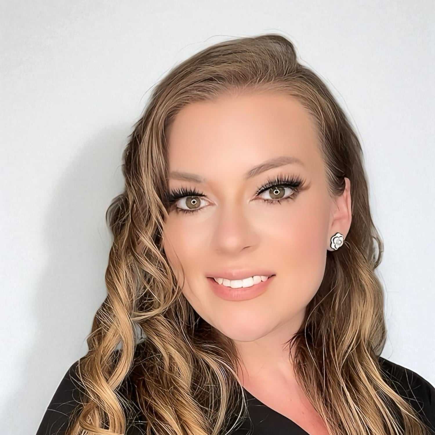 Portrait of Rene	S, a professional stylist at Design 1 Salon & Spa, showcasing their expertise and style.