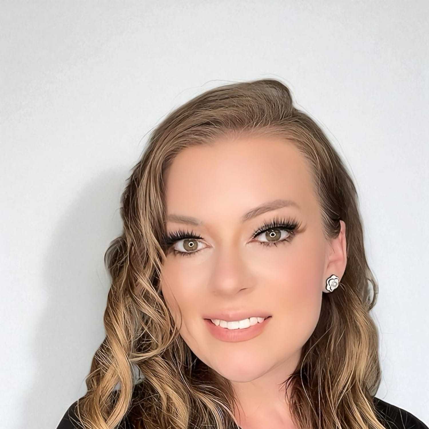 Portrait of Rene	S, a professional stylist at Design 1 Salon & Spa, showcasing their expertise and style.