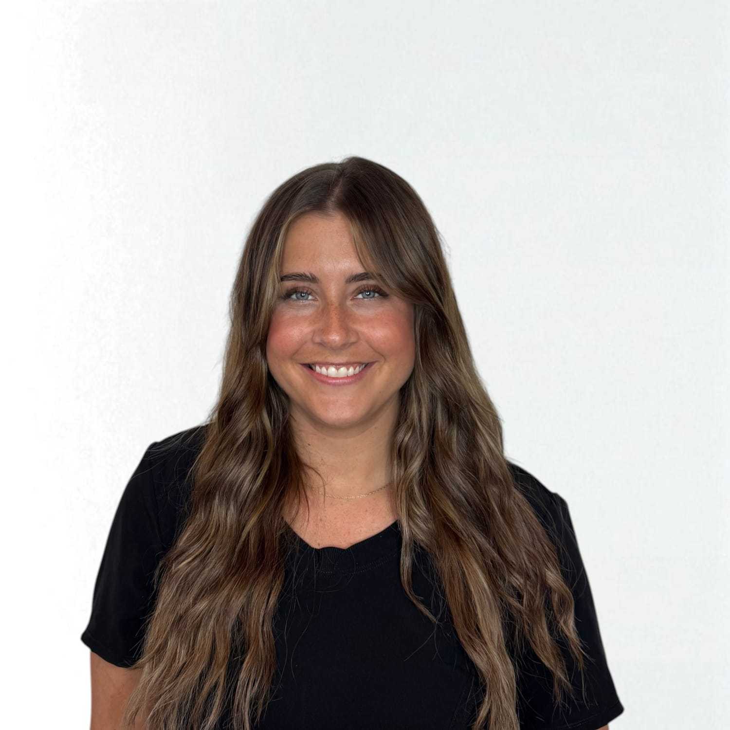 Portrait of Samantha	F, a professional stylist at Design 1 Salon & Spa, showcasing their expertise and style.