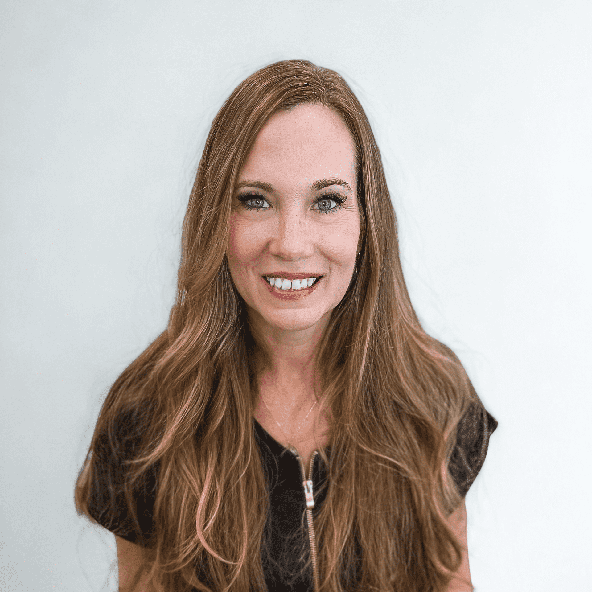 Portrait of Nicky V, a professional stylist at Design 1 Salon & Spa, showcasing their expertise and style.