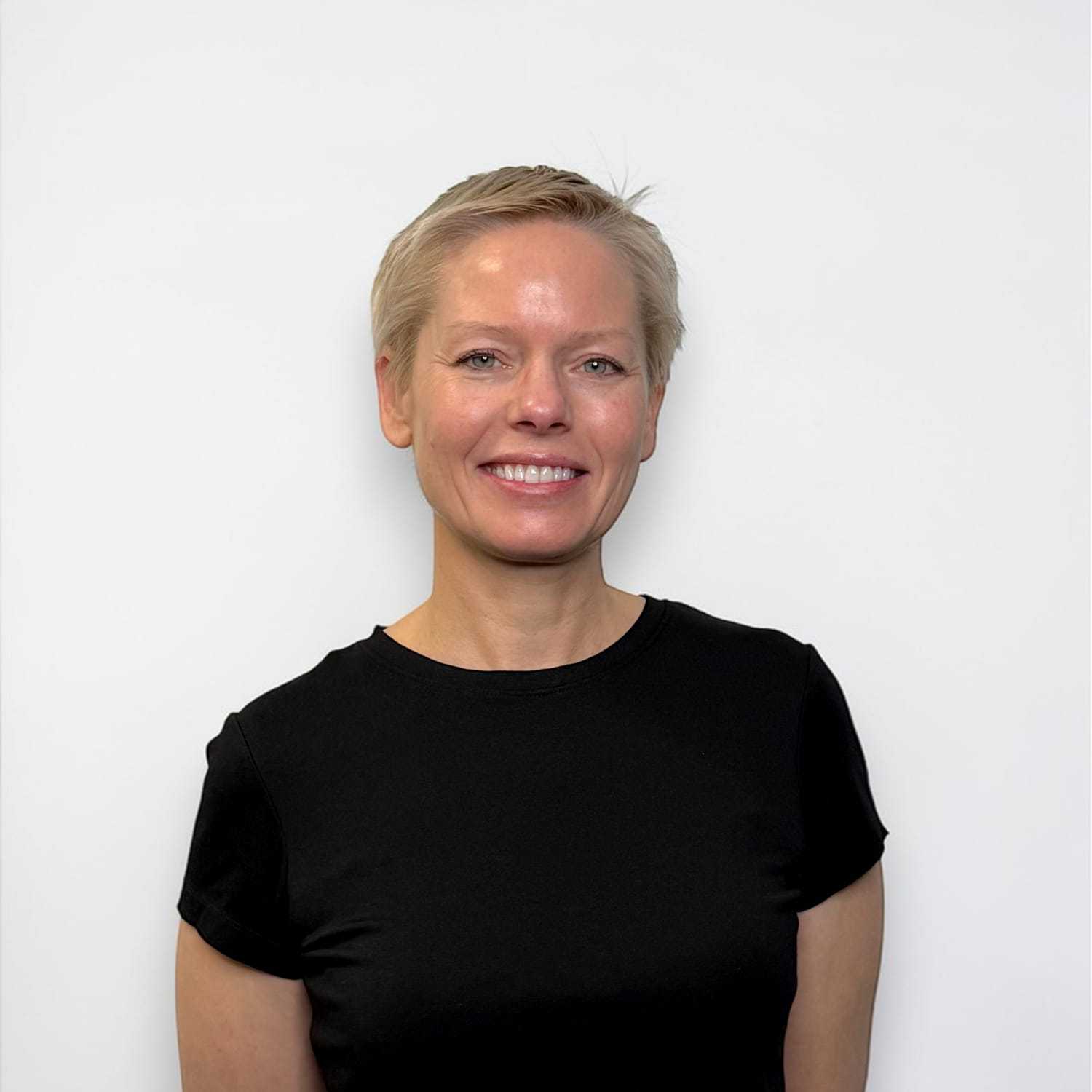 Portrait of Anna M, a professional stylist at Design 1 Salon & Spa, showcasing their expertise and style.