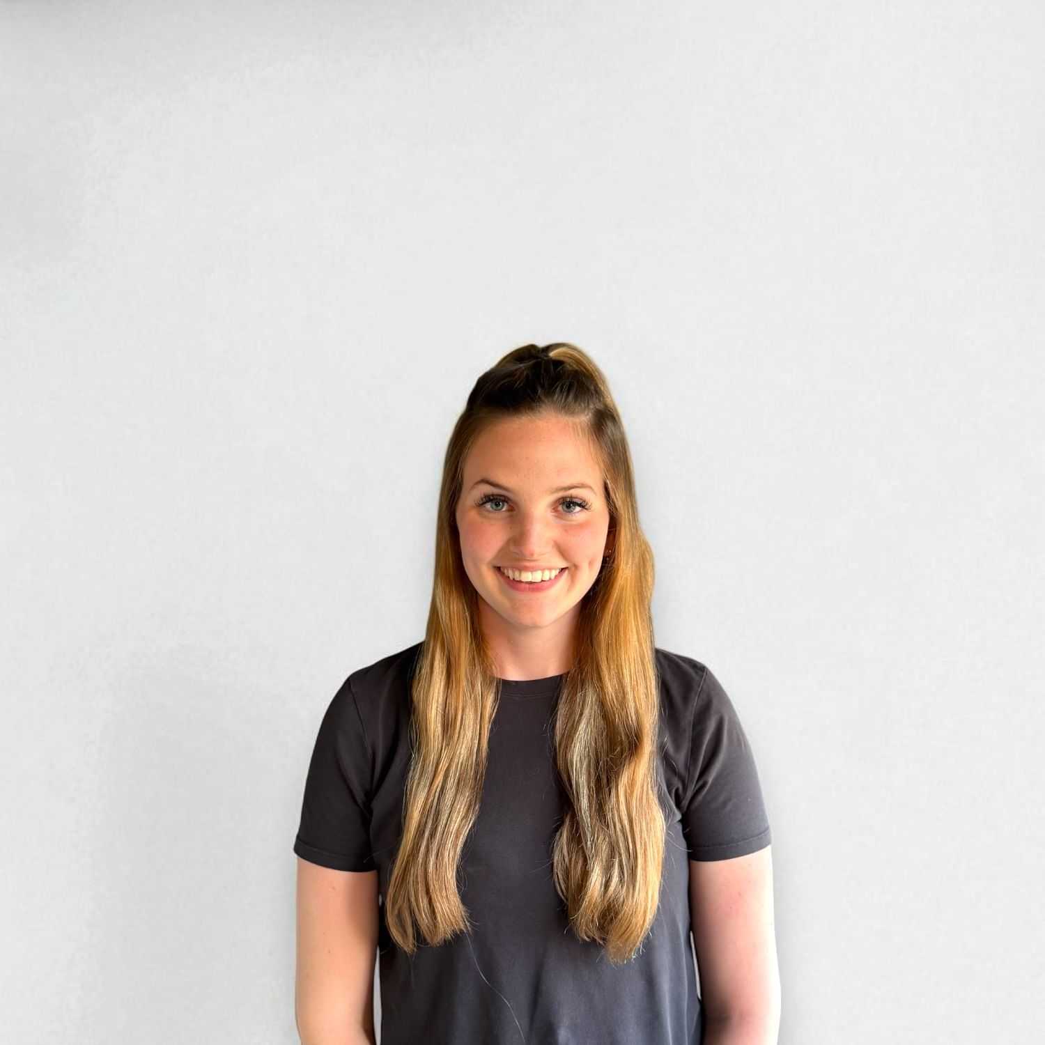 Portrait of Emily E, a professional stylist at Design 1 Salon & Spa, showcasing their expertise and style.