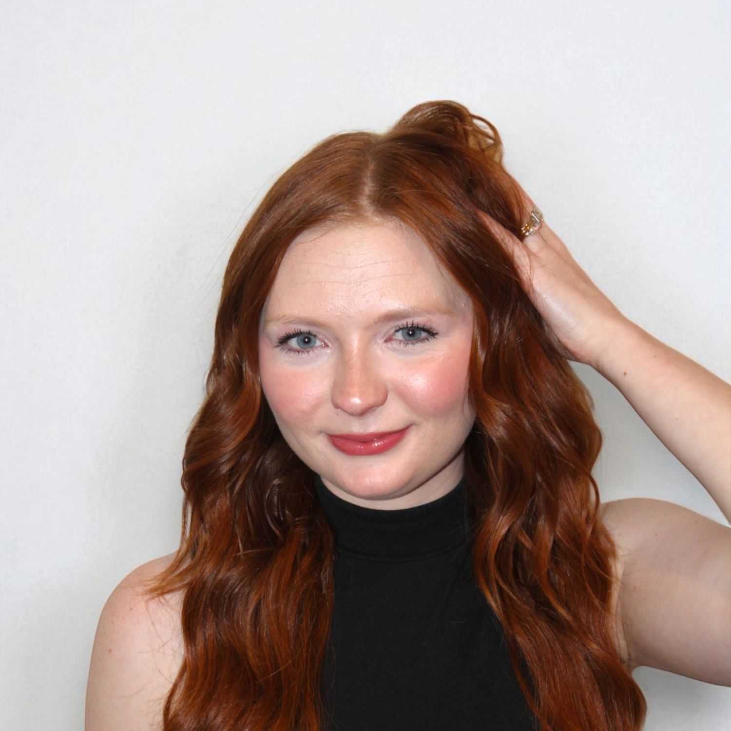 Portrait of Cali S, a professional stylist at Design 1 Salon & Spa, showcasing their expertise and style.