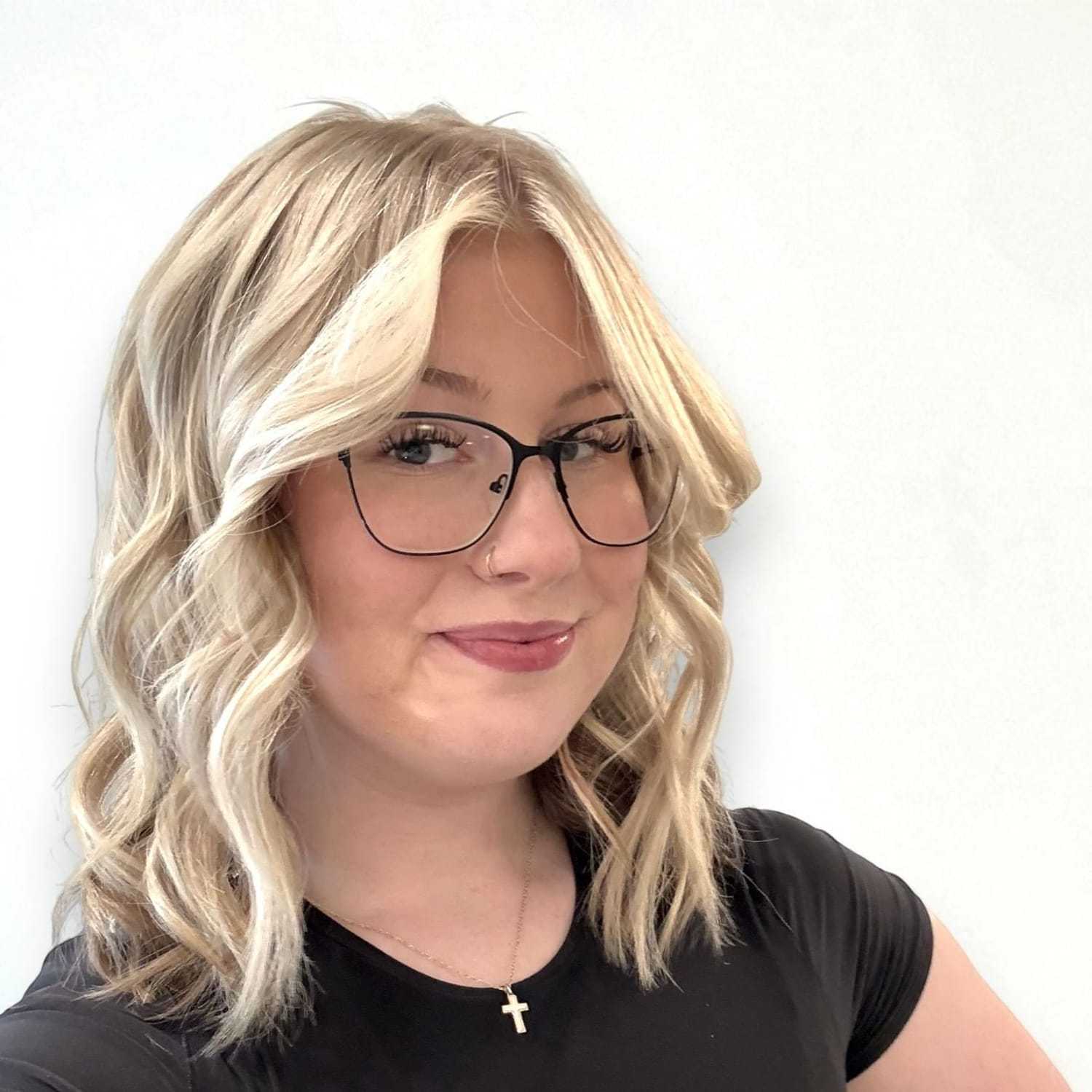 Portrait of Graycee B, a professional stylist at Design 1 Salon & Spa, showcasing their expertise and style.