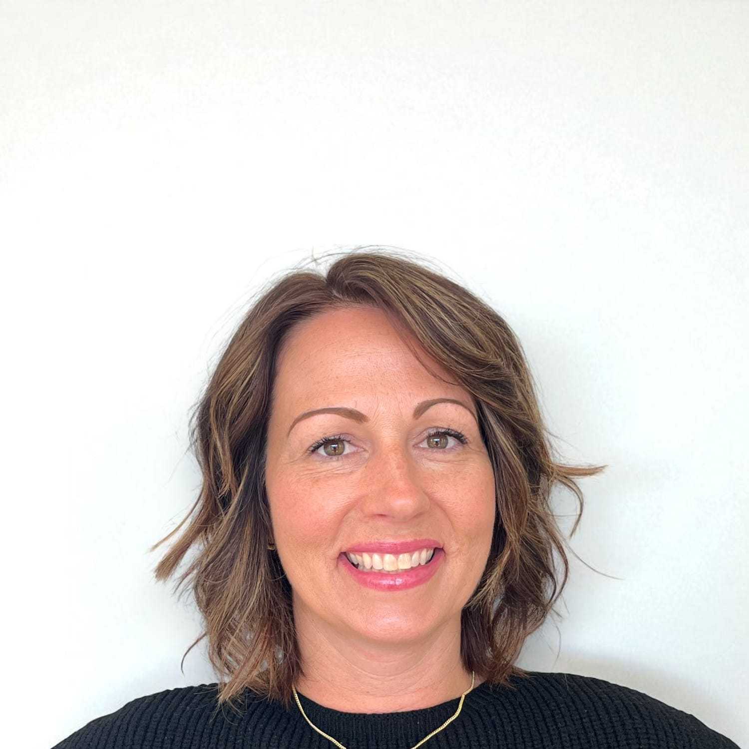 Portrait of Mary T, a professional stylist at Design 1 Salon & Spa, showcasing their expertise and style.
