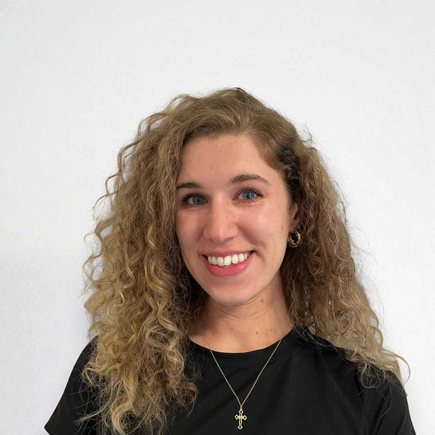 Portrait of Juliana M, a professional stylist at Design 1 Salon & Spa, showcasing their expertise and style.