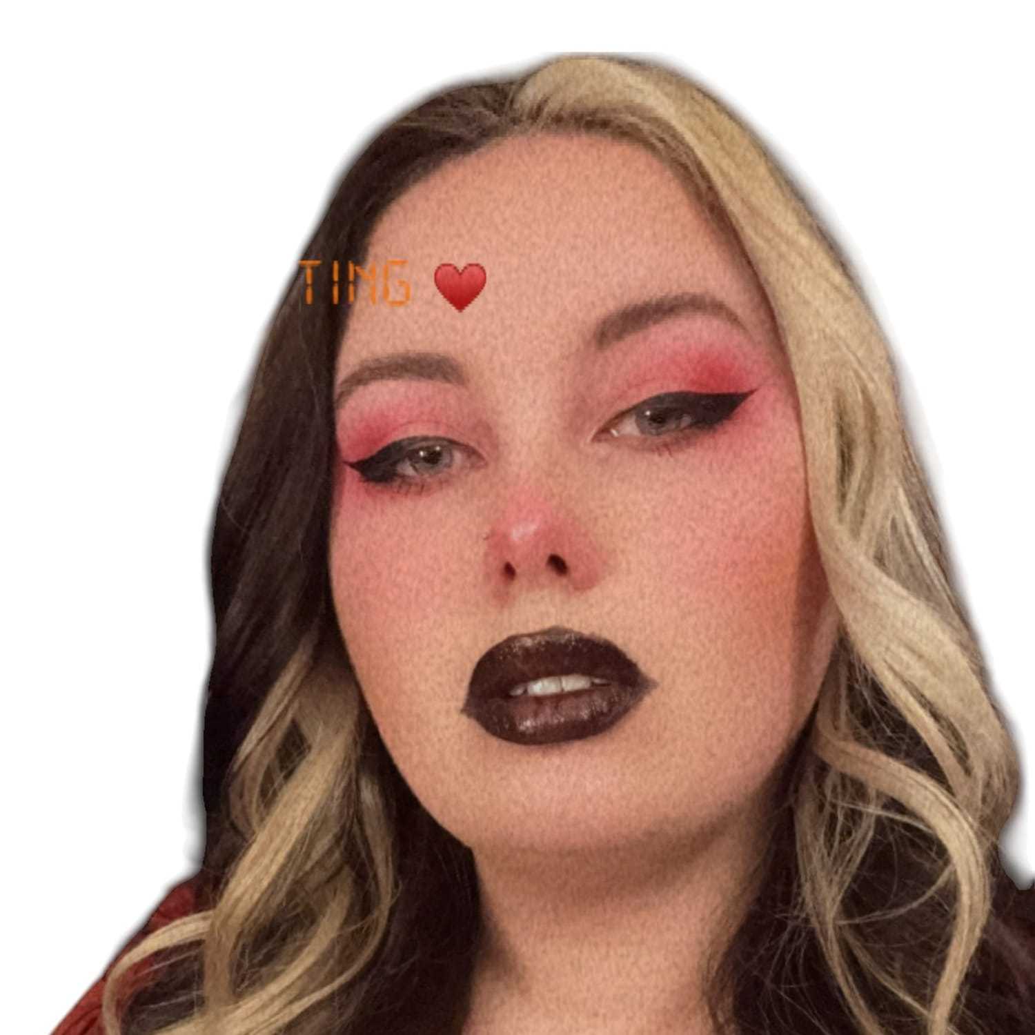 Portrait of Riot H, a professional stylist at Design 1 Salon & Spa, showcasing their expertise and style.