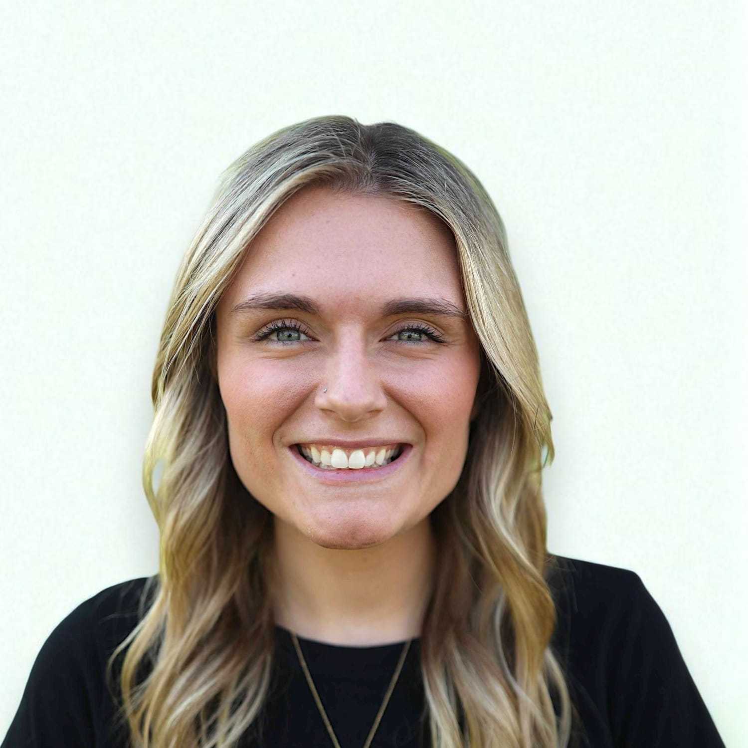 Portrait of Samantha	P, a professional stylist at Design 1 Salon & Spa, showcasing their expertise and style.