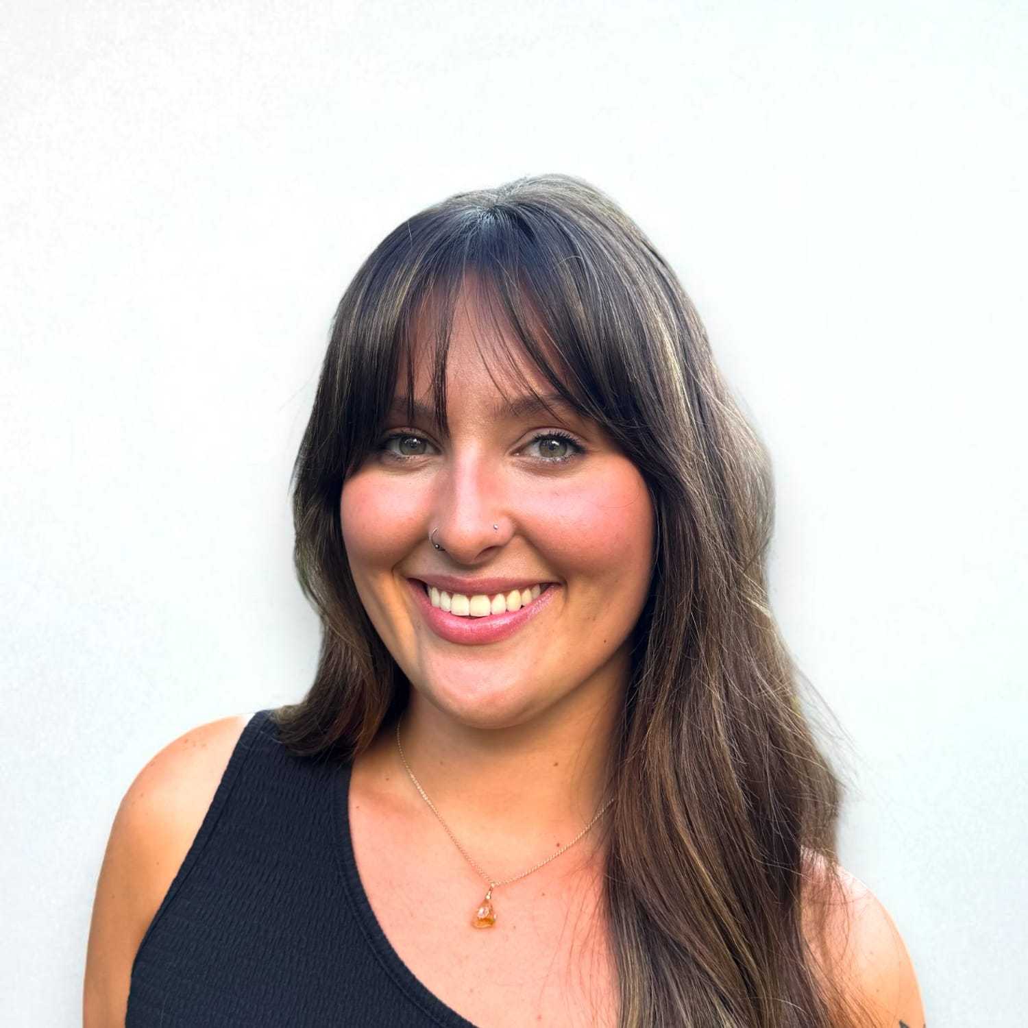 Portrait of Madison R, a professional stylist at Design 1 Salon & Spa, showcasing their expertise and style.