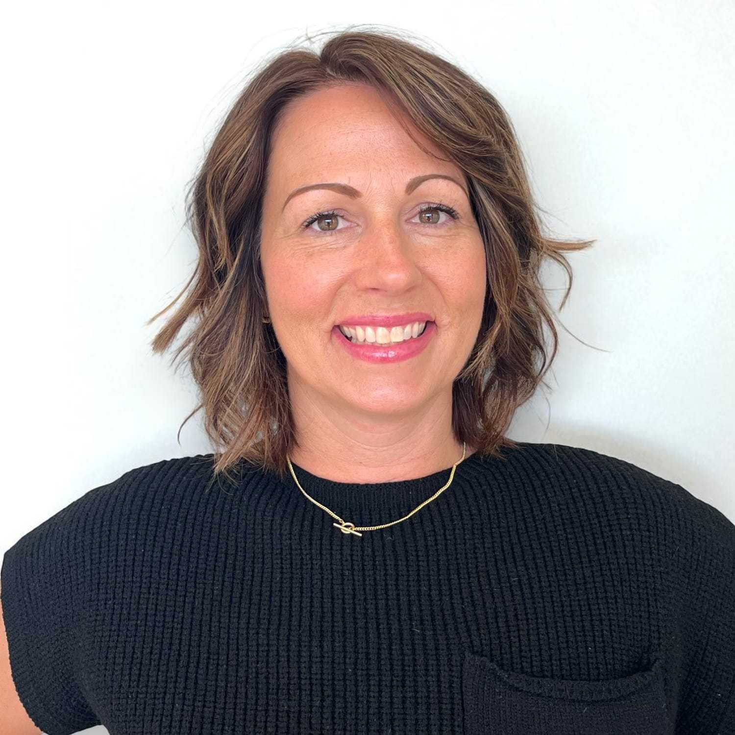 Portrait of Mary T, a professional stylist at Design 1 Salon & Spa, showcasing their expertise and style.