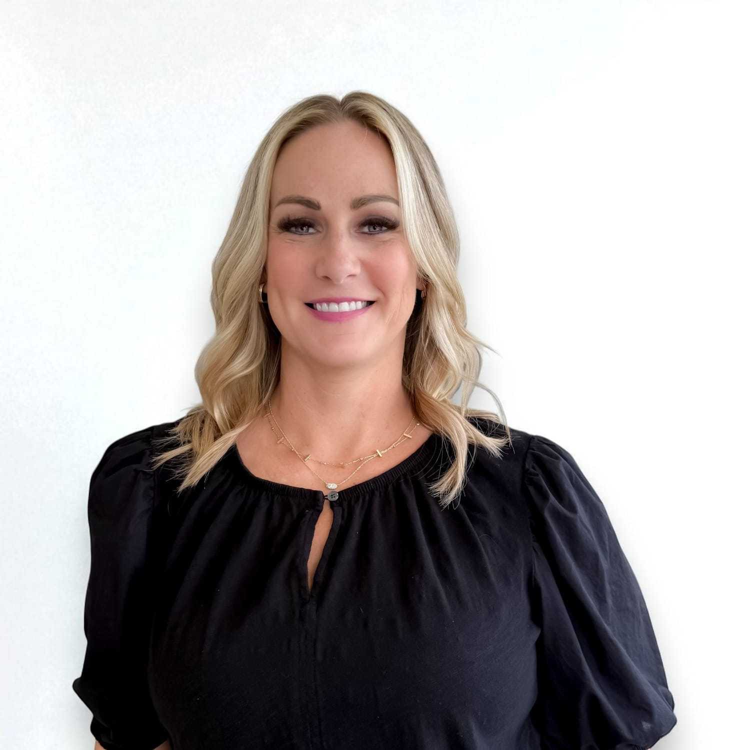 Portrait of Heidi C, a professional stylist at Design 1 Salon & Spa, showcasing their expertise and style.