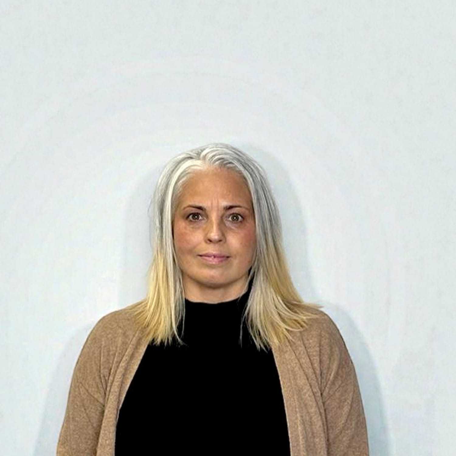 Portrait of Jeannie T, a professional stylist at Design 1 Salon & Spa, showcasing their expertise and style.