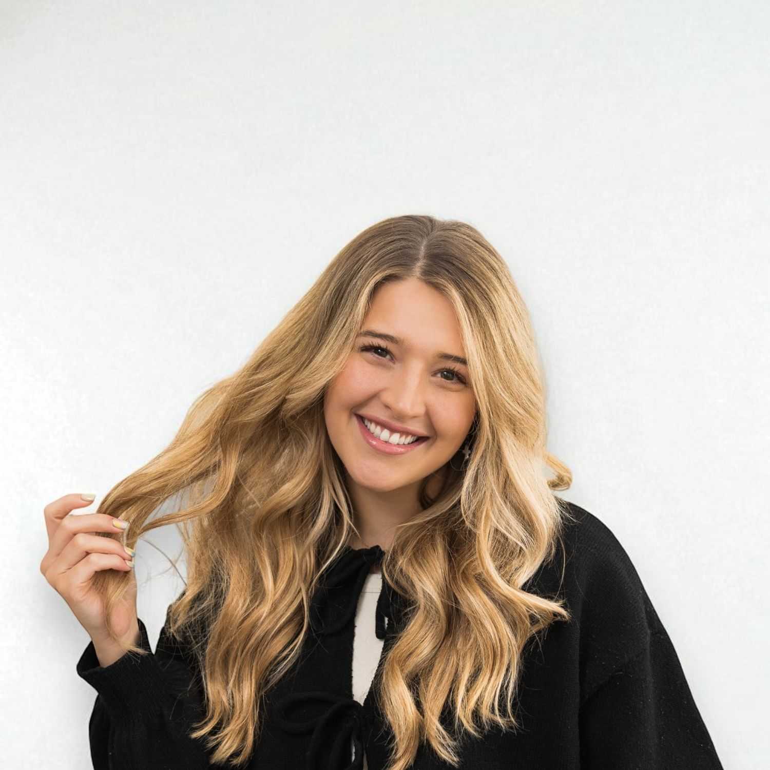 Portrait of Keaton D, a professional stylist at Design 1 Salon & Spa, showcasing their expertise and style.