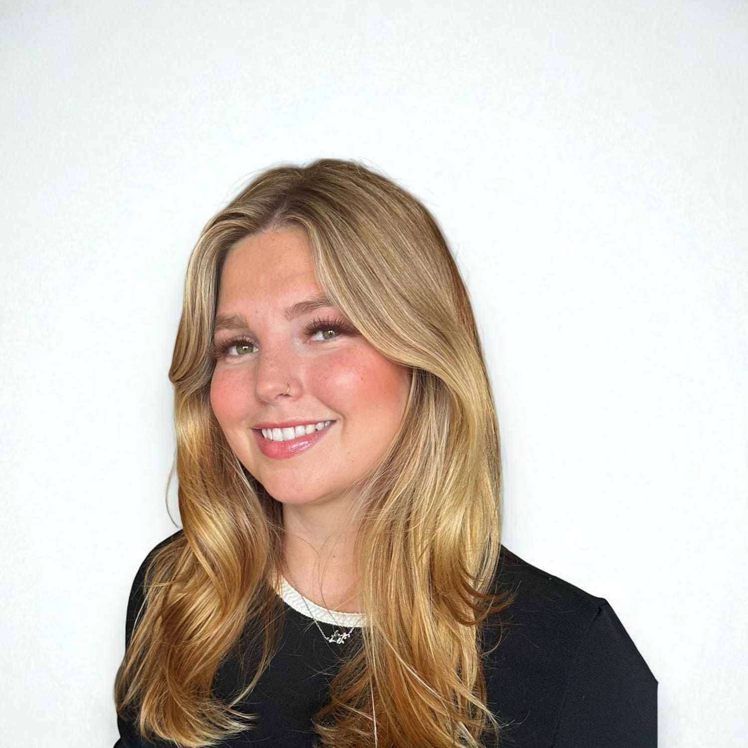 Portrait of Daniela B, a professional stylist at Design 1 Salon & Spa, showcasing their expertise and style.