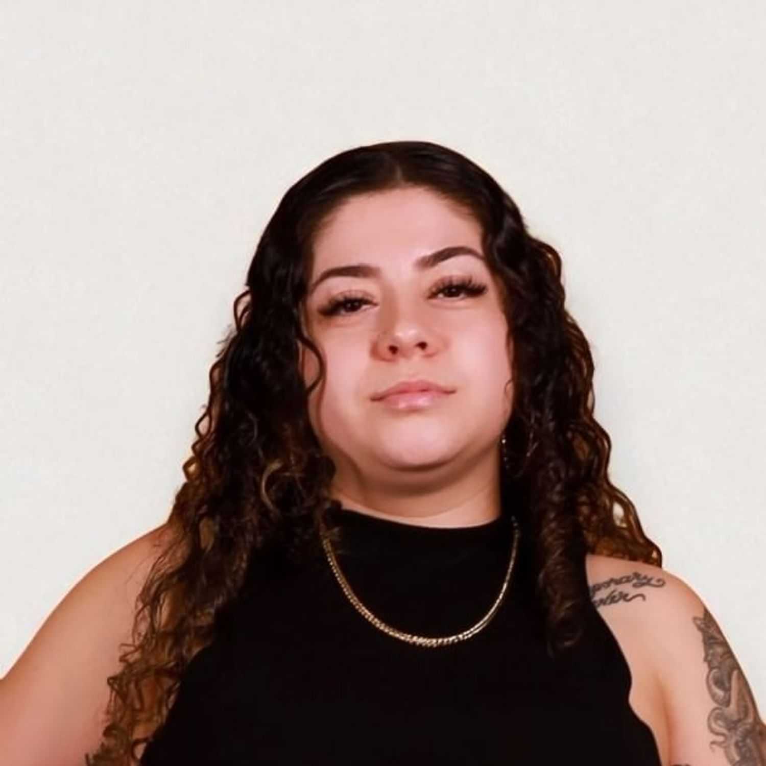 Portrait of Brittany M, a professional stylist at Design 1 Salon & Spa, showcasing their expertise and style.