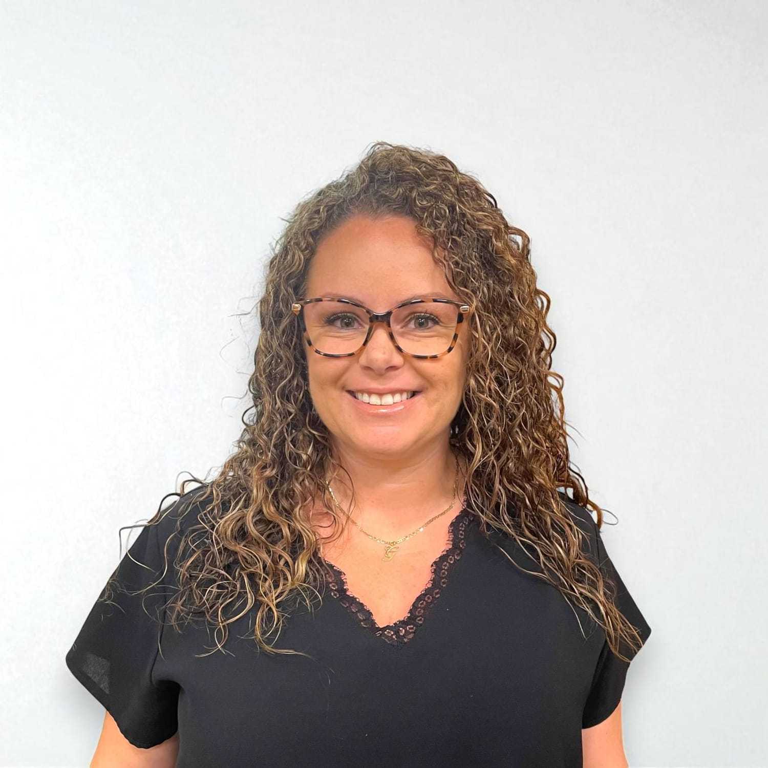 Portrait of Lindsay B, a professional stylist at Design 1 Salon & Spa, showcasing their expertise and style.