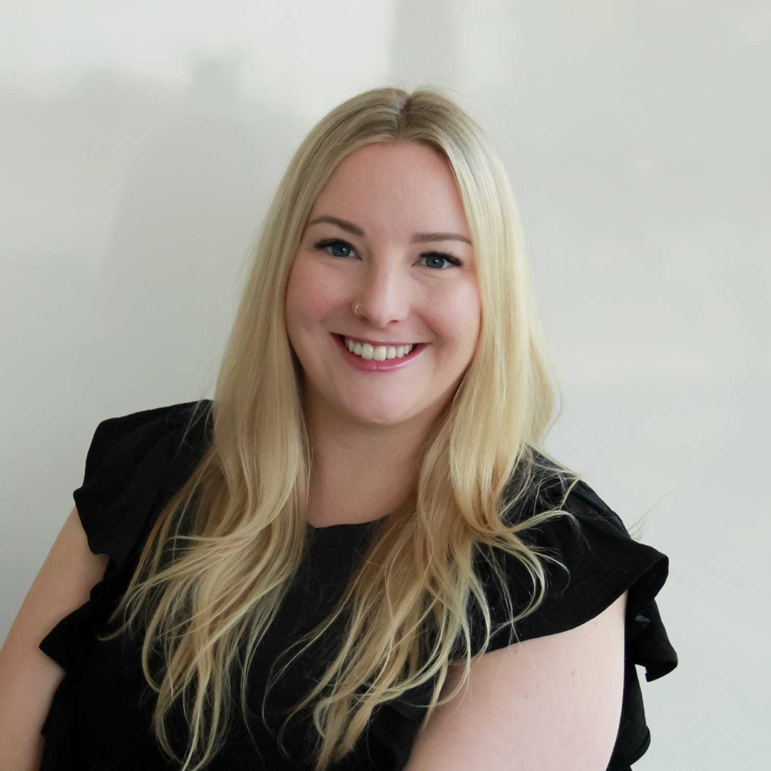 Portrait of Elle S, a professional stylist at Design 1 Salon & Spa, showcasing their expertise and style.