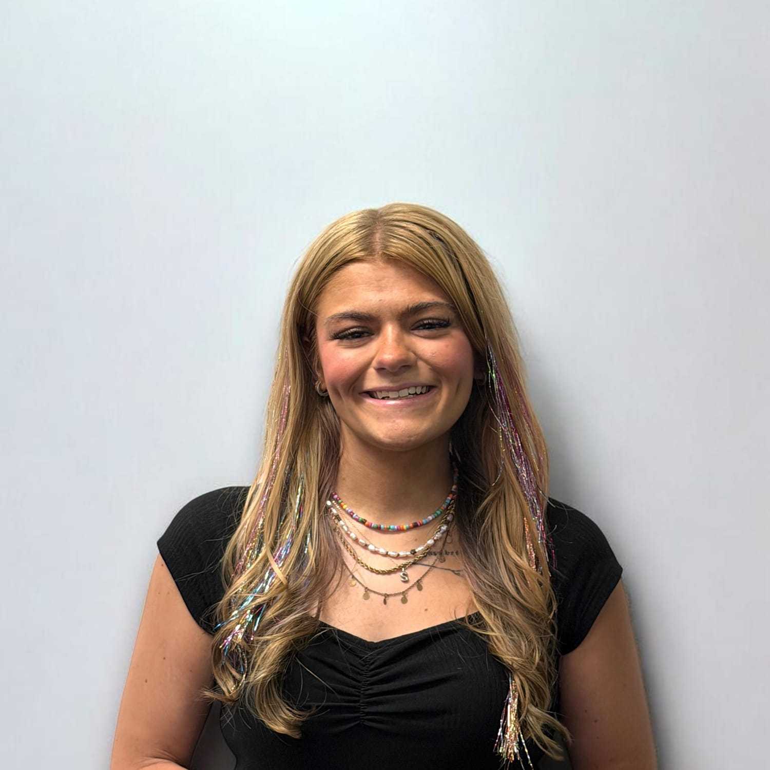 Portrait of Sierra H, a professional stylist at Design 1 Salon & Spa, showcasing their expertise and style.