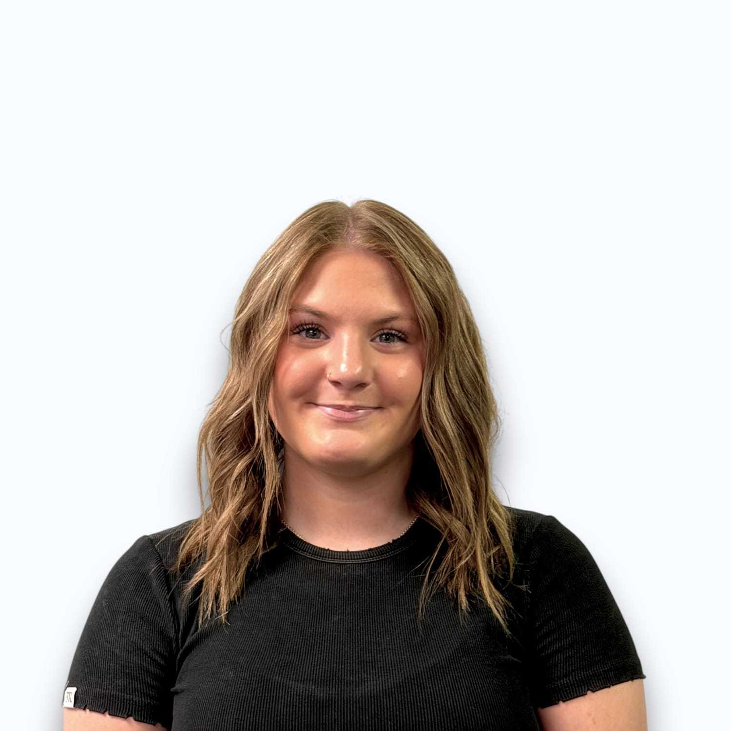 Portrait of Reese C, a professional stylist at Design 1 Salon & Spa, showcasing their expertise and style.