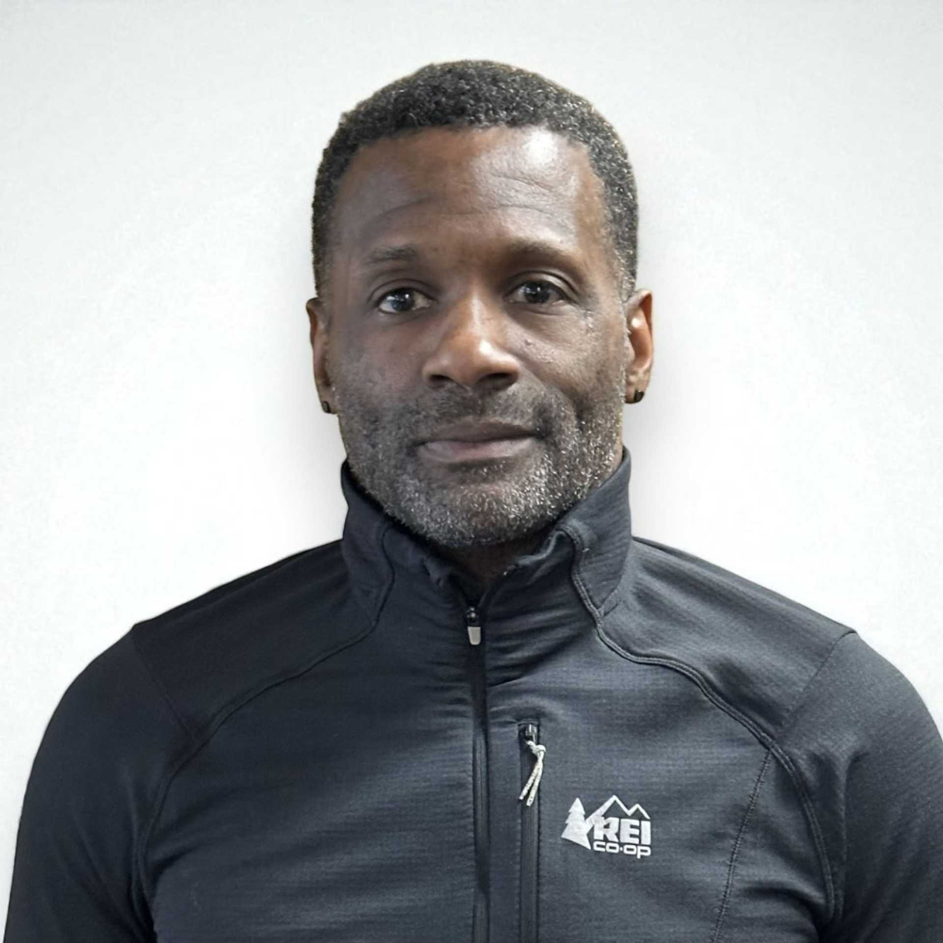 Portrait of Kevin C, a professional stylist at Design 1 Salon & Spa, showcasing their expertise and style.