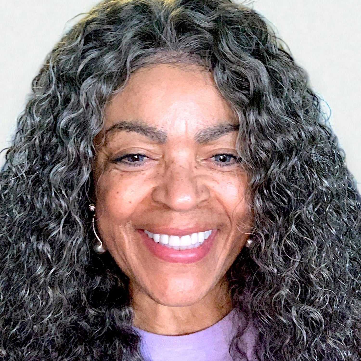 Portrait of Dana	A, a professional stylist at Design 1 Salon & Spa, showcasing their expertise and style.
