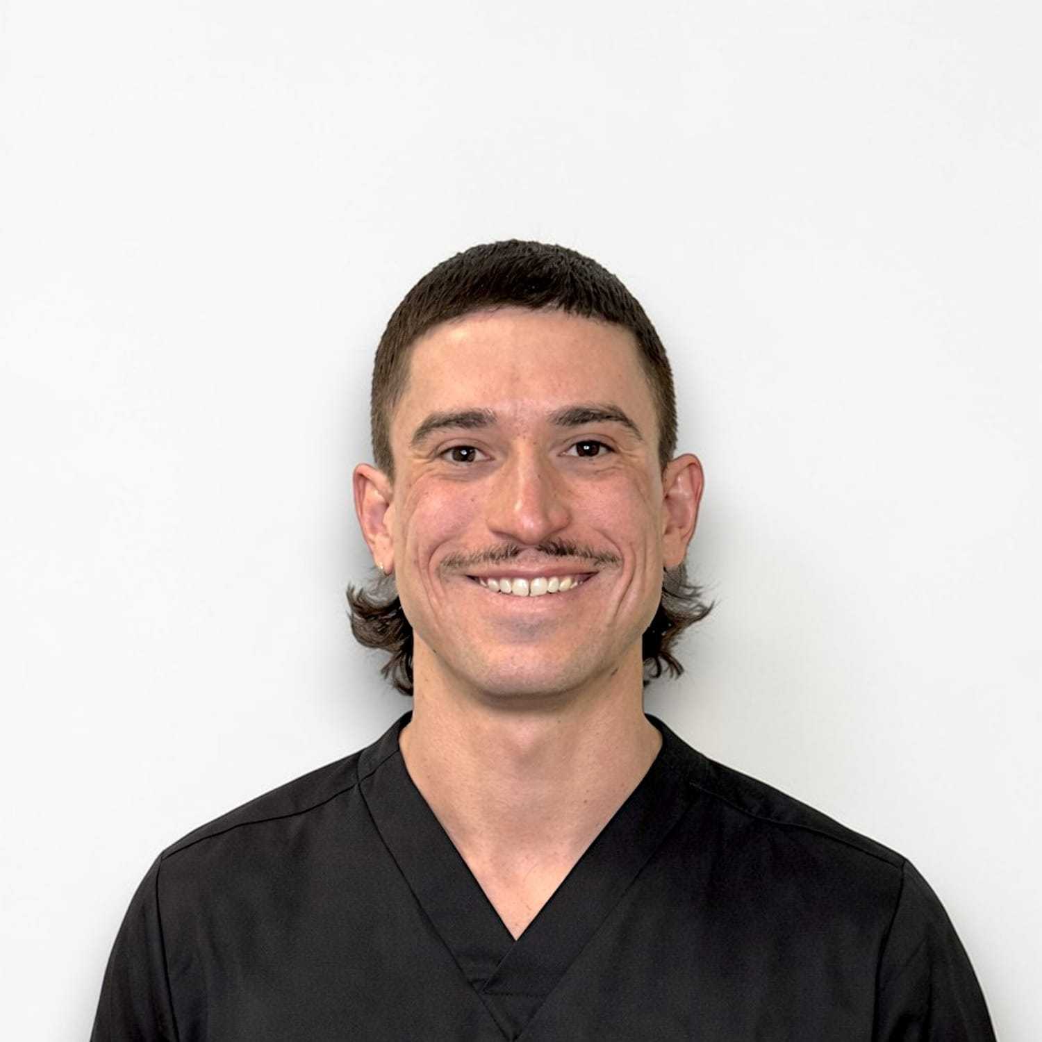 Portrait of Cameron N, a professional stylist at Design 1 Salon & Spa, showcasing their expertise and style.