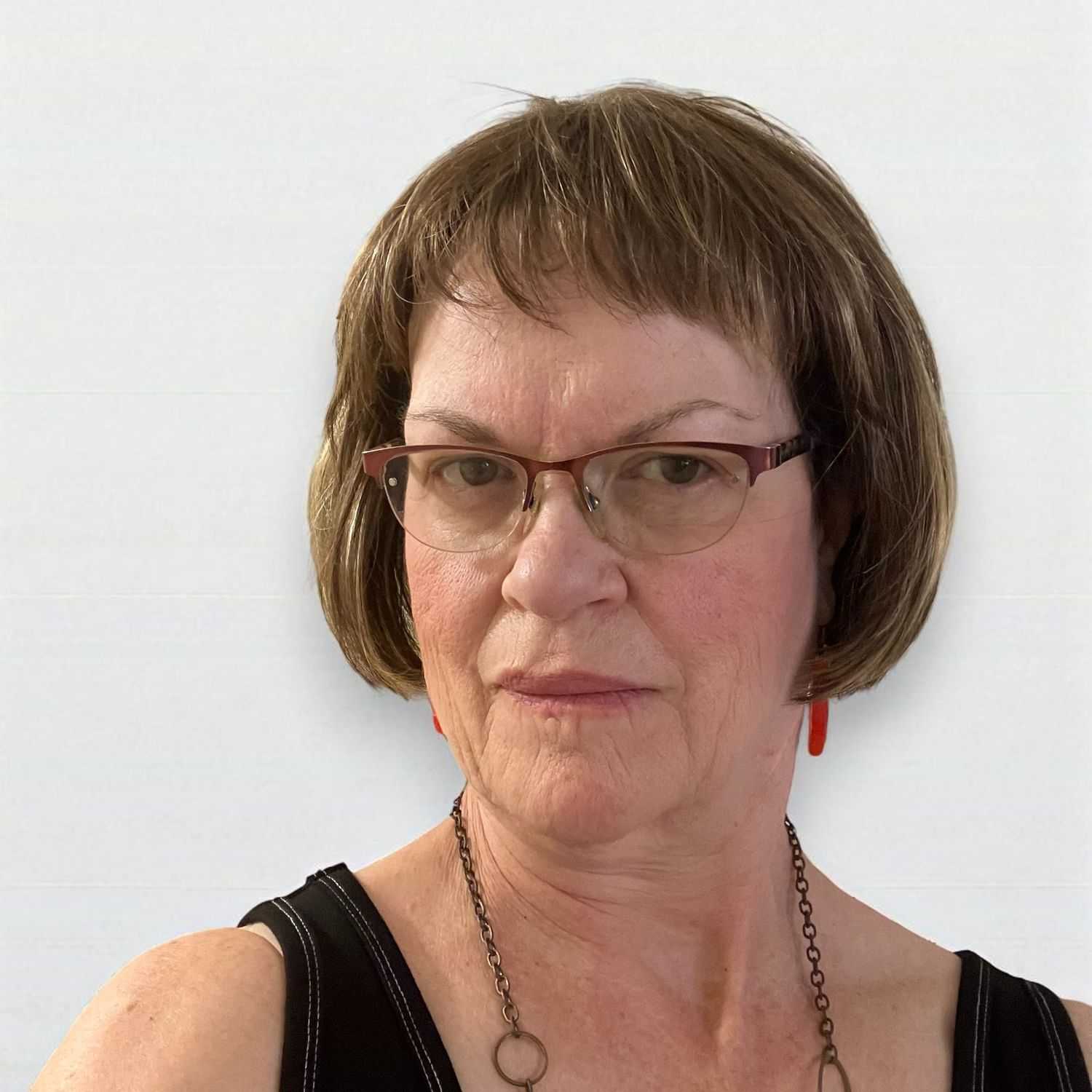 Portrait of Diane Z, a professional stylist at Design 1 Salon & Spa, showcasing their expertise and style.