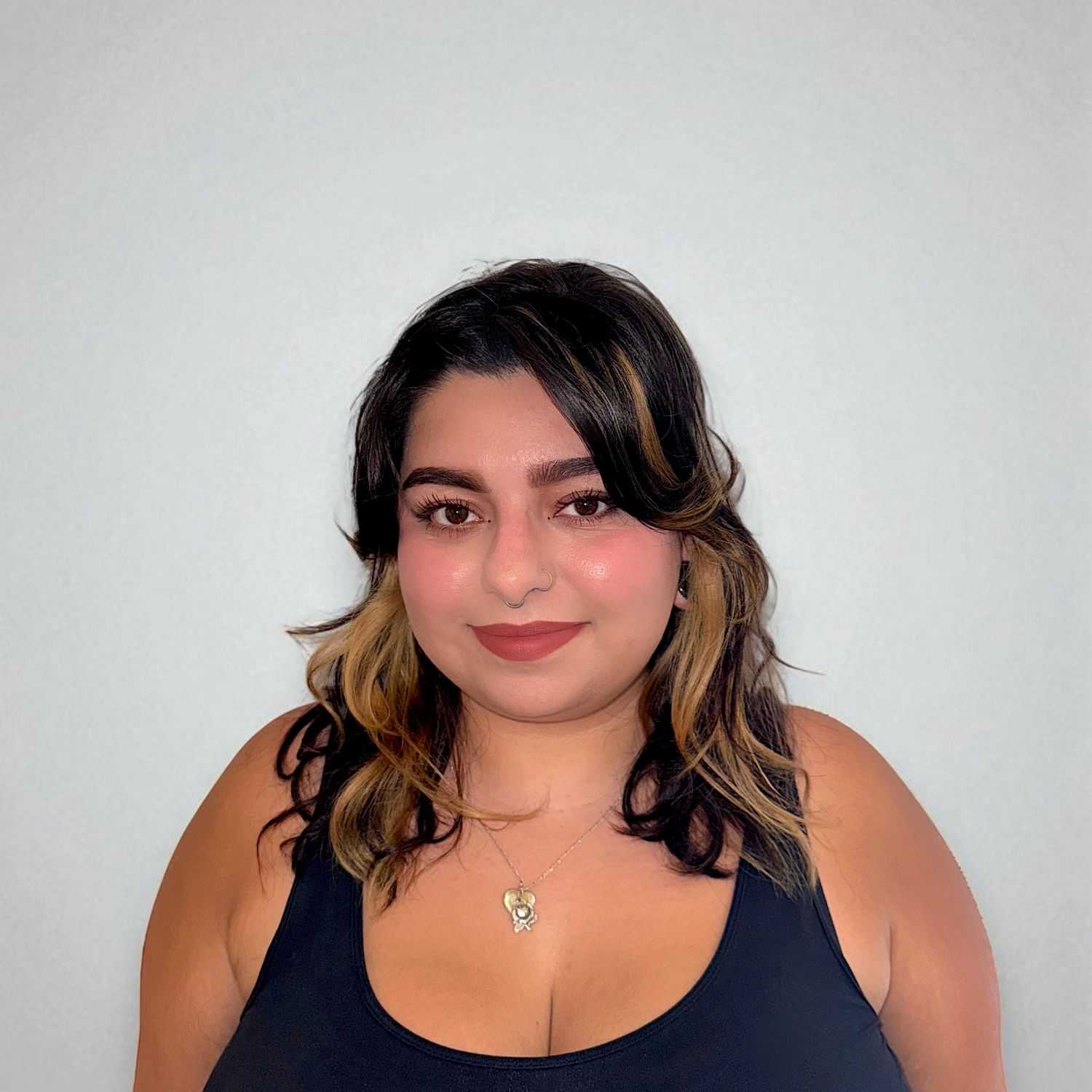 Portrait of Jessica H, a professional stylist at Design 1 Salon & Spa, showcasing their expertise and style.