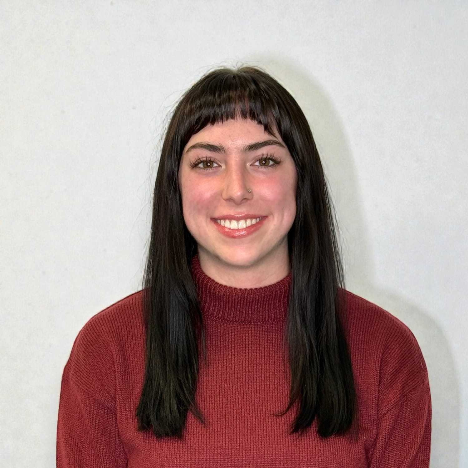 Portrait of Paige F, a professional stylist at Design 1 Salon & Spa, showcasing their expertise and style.