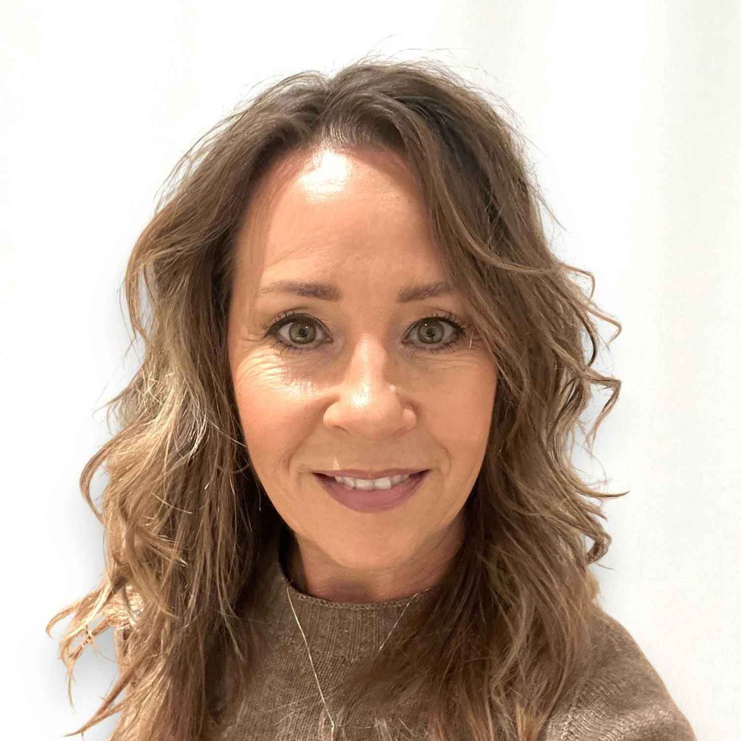 Portrait of Sandi W, a professional stylist at Design 1 Salon & Spa, showcasing their expertise and style.