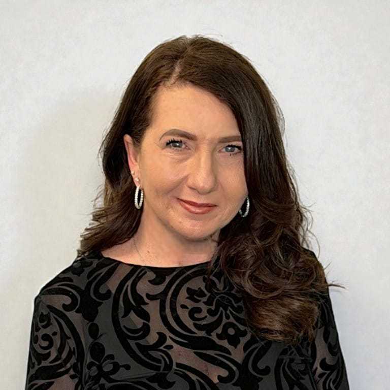 Portrait of Nanette G, a professional stylist at Design 1 Salon & Spa, showcasing their expertise and style.