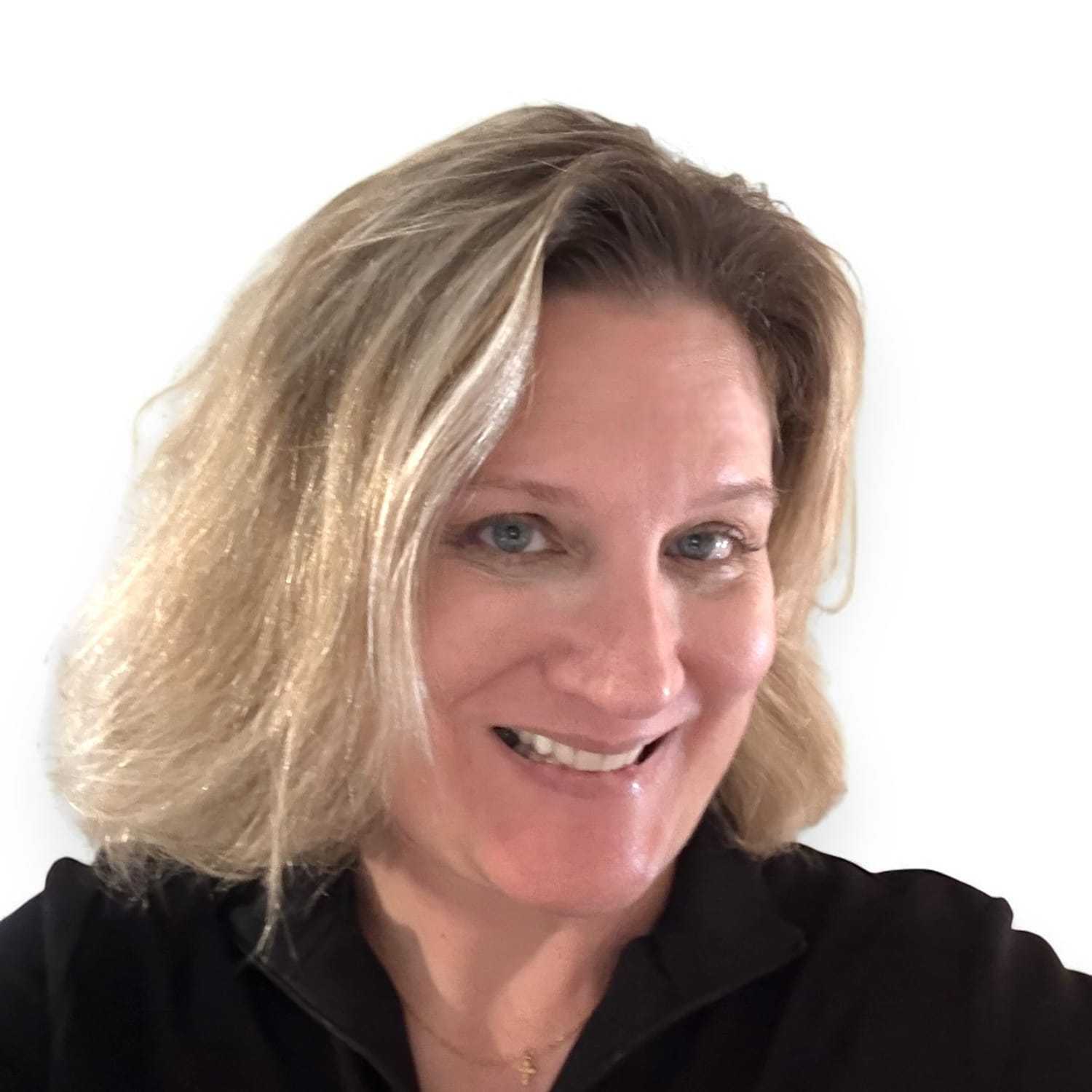 Portrait of Wendy	K, a professional stylist at Design 1 Salon & Spa, showcasing their expertise and style.