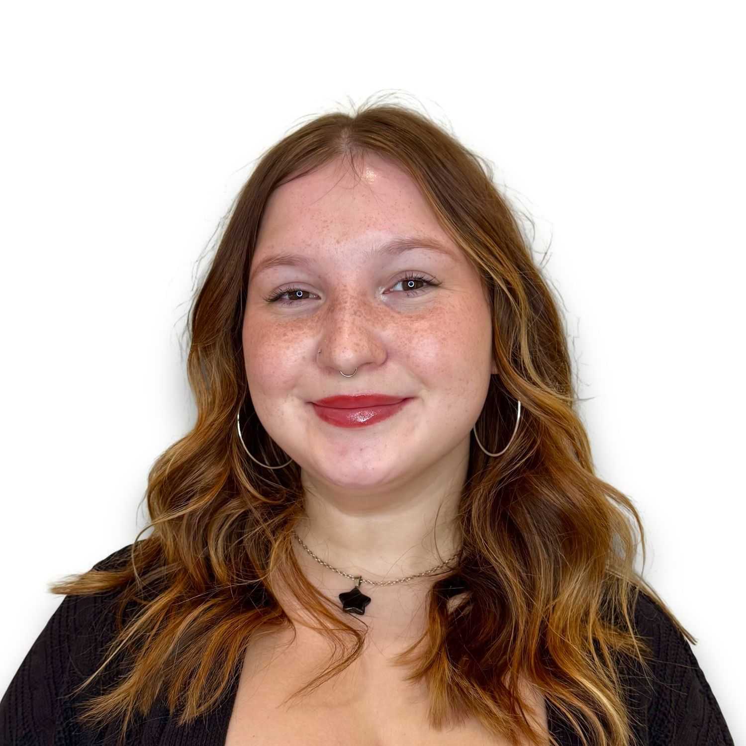 Portrait of Jordan W, a professional stylist at Design 1 Salon & Spa, showcasing their expertise and style.