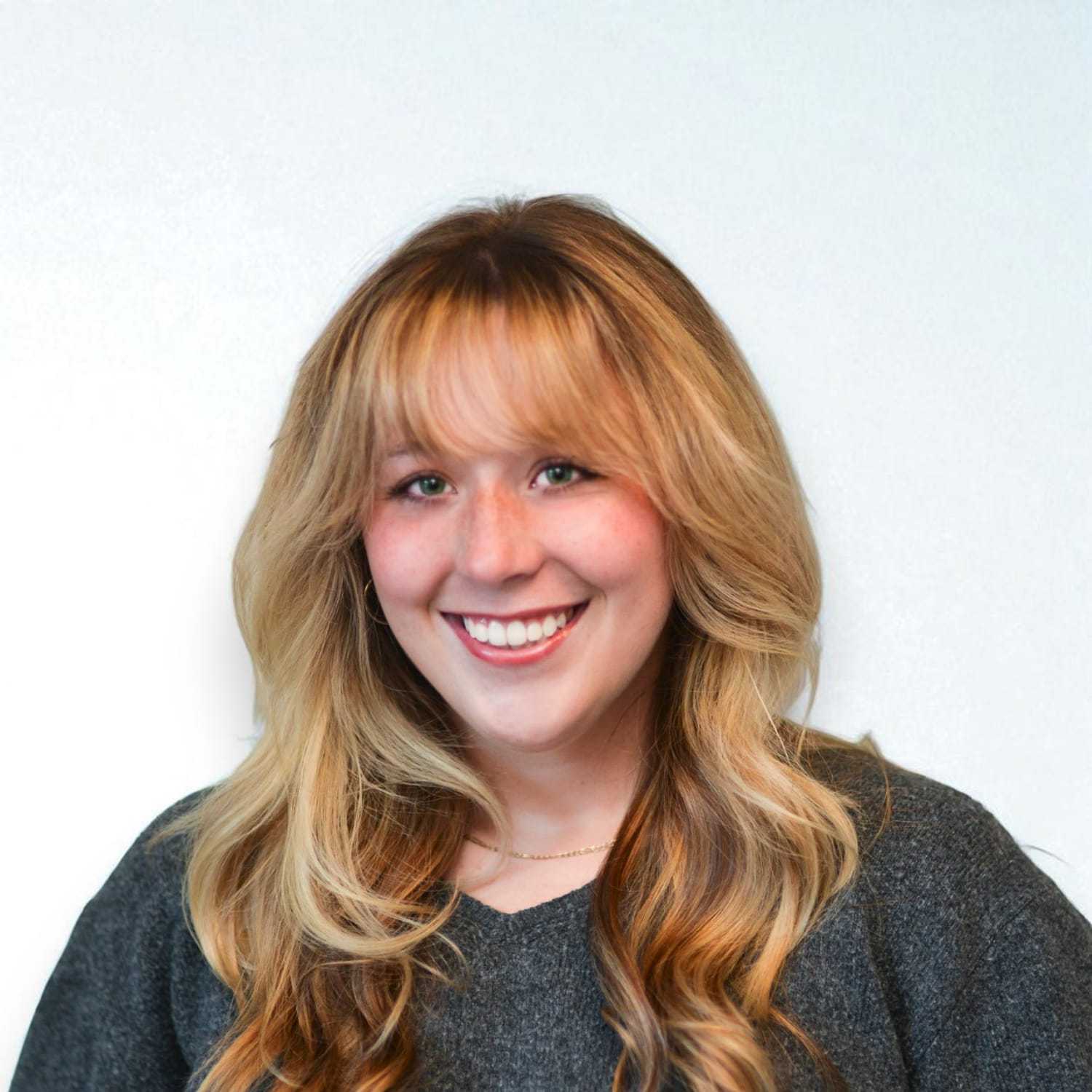 Portrait of Laci W, a professional stylist at Design 1 Salon & Spa, showcasing their expertise and style.