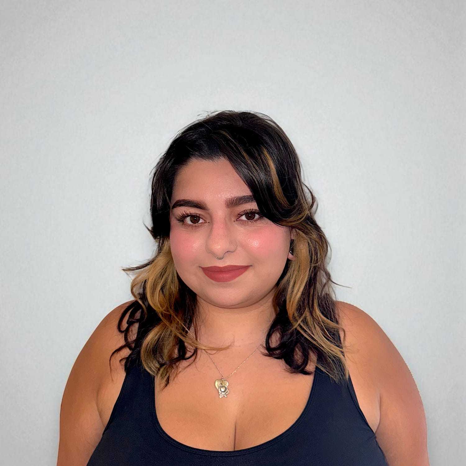 Portrait of Jessica H, a professional stylist at Design 1 Salon & Spa, showcasing their expertise and style.