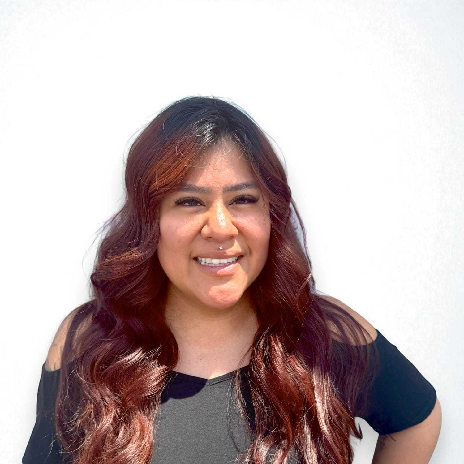 Portrait of Anna Marie C, a professional stylist at Design 1 Salon & Spa, showcasing their expertise and style.