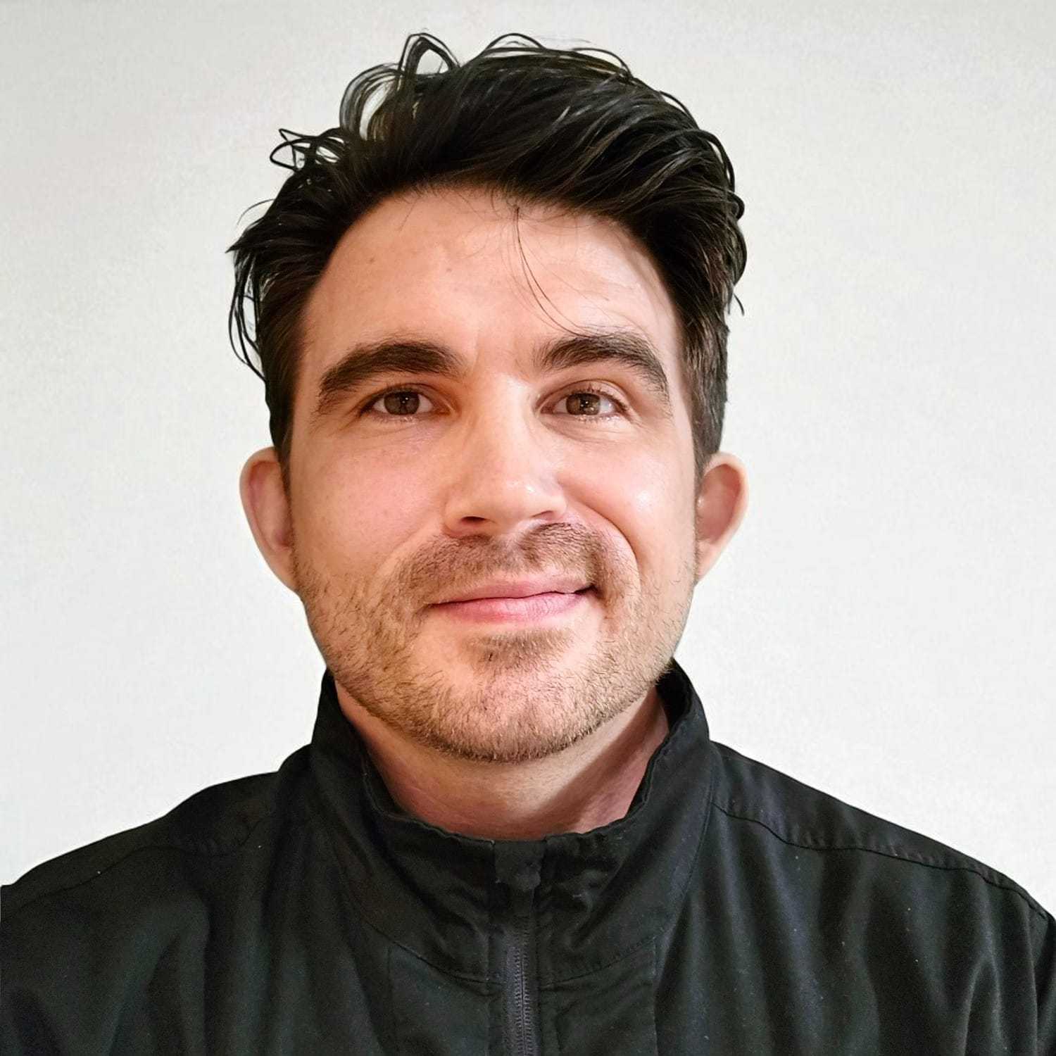 Portrait of Jake G, a professional stylist at Design 1 Salon & Spa, showcasing their expertise and style.